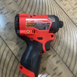 Milwaukee Red and Black Impact Driver